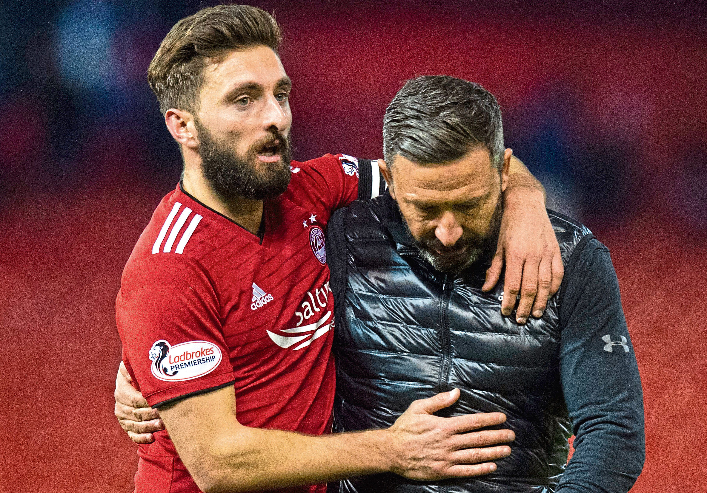 Aberdeen captain Graeme Shinnie celebrates with manager Derek McInnes at full time.