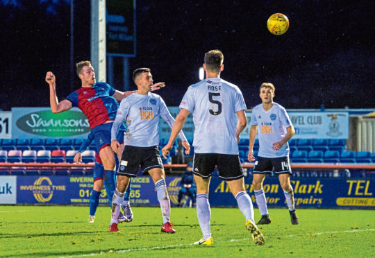 Inverness CT's Jordan White (L) heads in Inverness' goal against Ayr