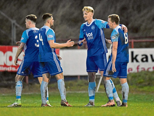 Peterhead's Russell Mclean celebrates  his goal with Cameron Eadie and Scott Brown