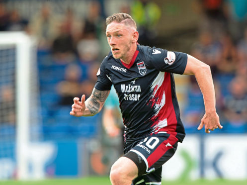 Declan McManus in action for Ross County.