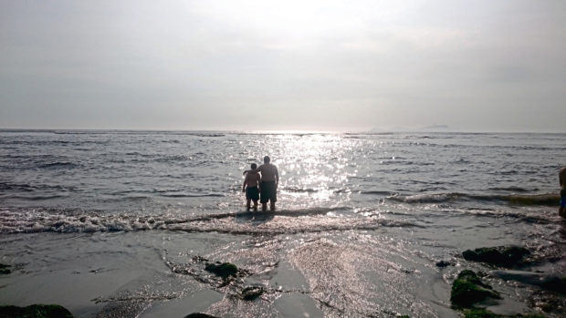 Taking a dip in the Pacific Ocean while in Peru.