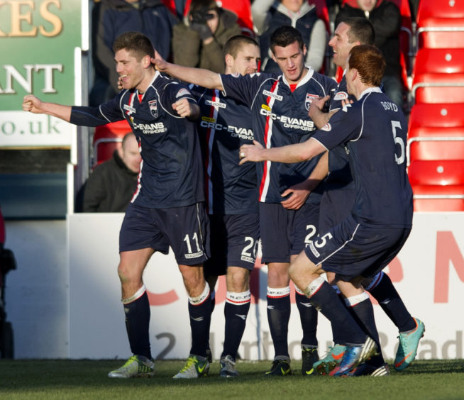 Ross County's Iain Vigurs (left) celebrates his deflection-aided equaliser with his team-mates.