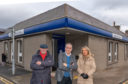 Moray MSP Richard Lochhead with Lossiemouth Community Council chairman Mike Mulholland and vice-chairwoman Carolle Ralph outside the Bank of Scotland in Lossiemouth