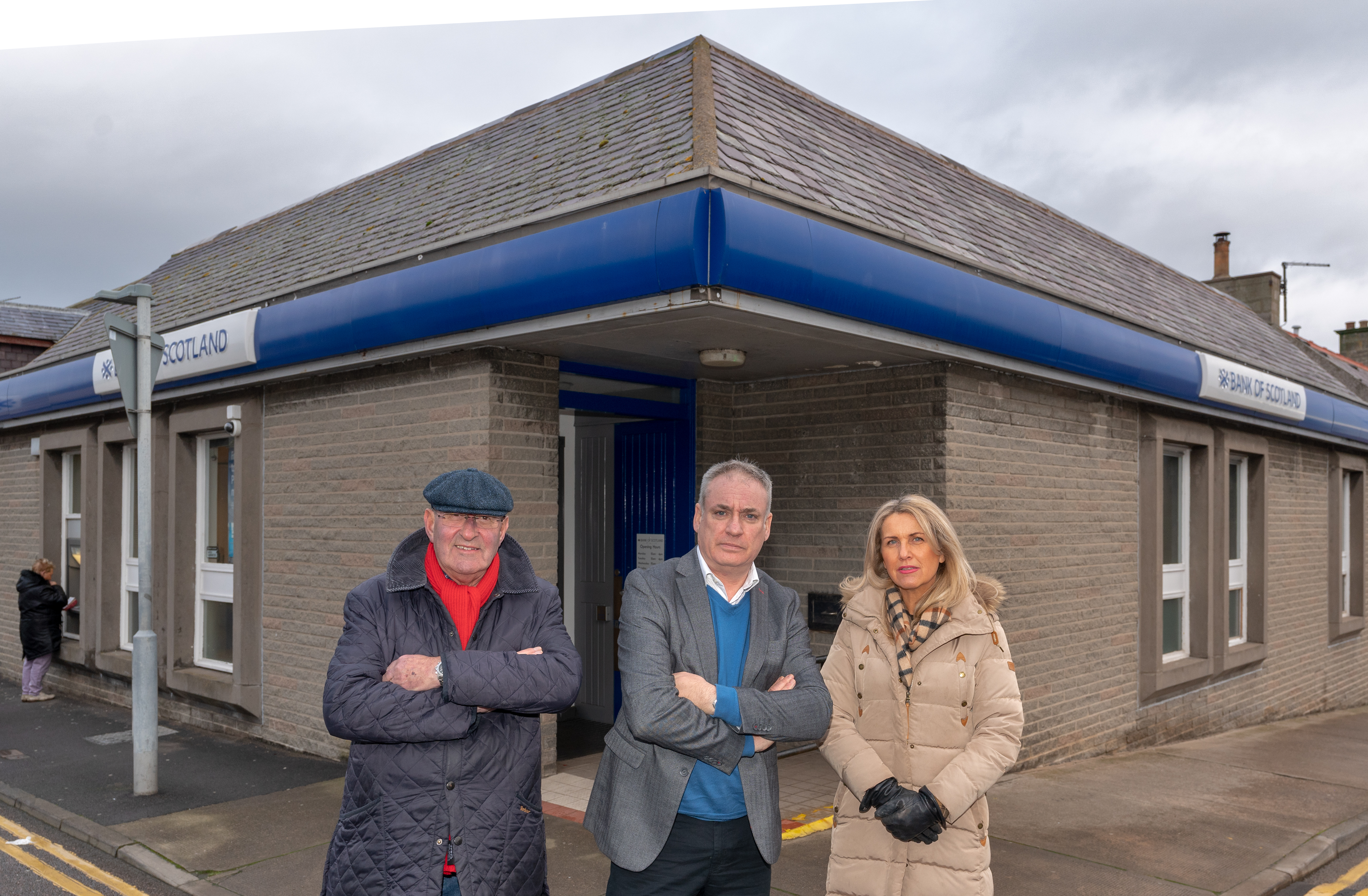 Moray MSP Richard Lochhead with Lossiemouth Community Council chairman Mike Mulholland and vice-chairwoman Carolle Ralph outside the Bank of Scotland in Lossiemouth