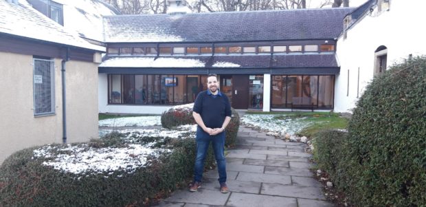 Reverend Mike Robertson outside the Barn Church.