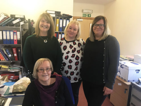 Jennifer Harvey, Wick development worker, Julie Marker, rural development worker, and Joan Lawrie, Thurso development worker, with part-time co-ordinator Yvonne Hendry at the front.