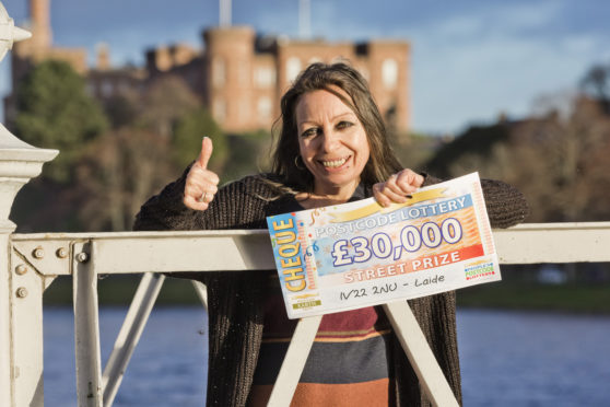 Daniele Martin with her cheque