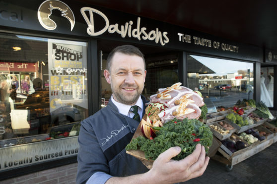 John Davidson pictured with his Pork Chops stuffed with Parsley, Red Chilli & Apple Butter
Picture by Graeme Hart.