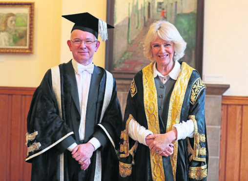 The Duchess of Cornwall, known as the Duchess of Rothesay in Scotland, after a ceremony at Elphinstone Hall, King's College, Aberdeen, to install Professor George Boyne (left) as Vice-Chancellor of the University of Aberdeen.