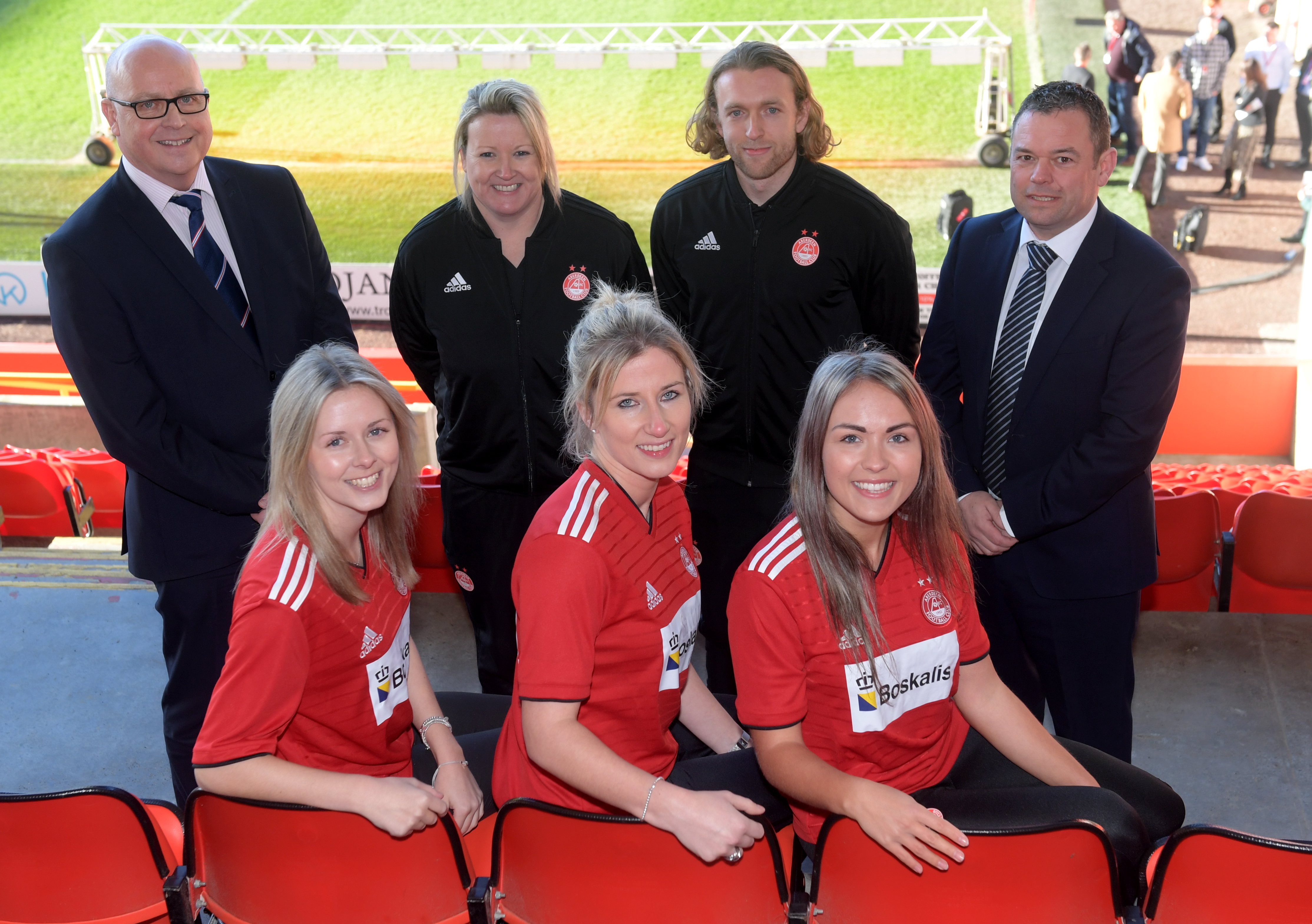 AFC Women's team players, from left, Loren Campbell, Kelly Forrest and Natasha Bruce. Back, Sponsor Tim Sheehan, Managers Emma Hunter and Harley Hamdani, with sponsor Stuart Cameron.