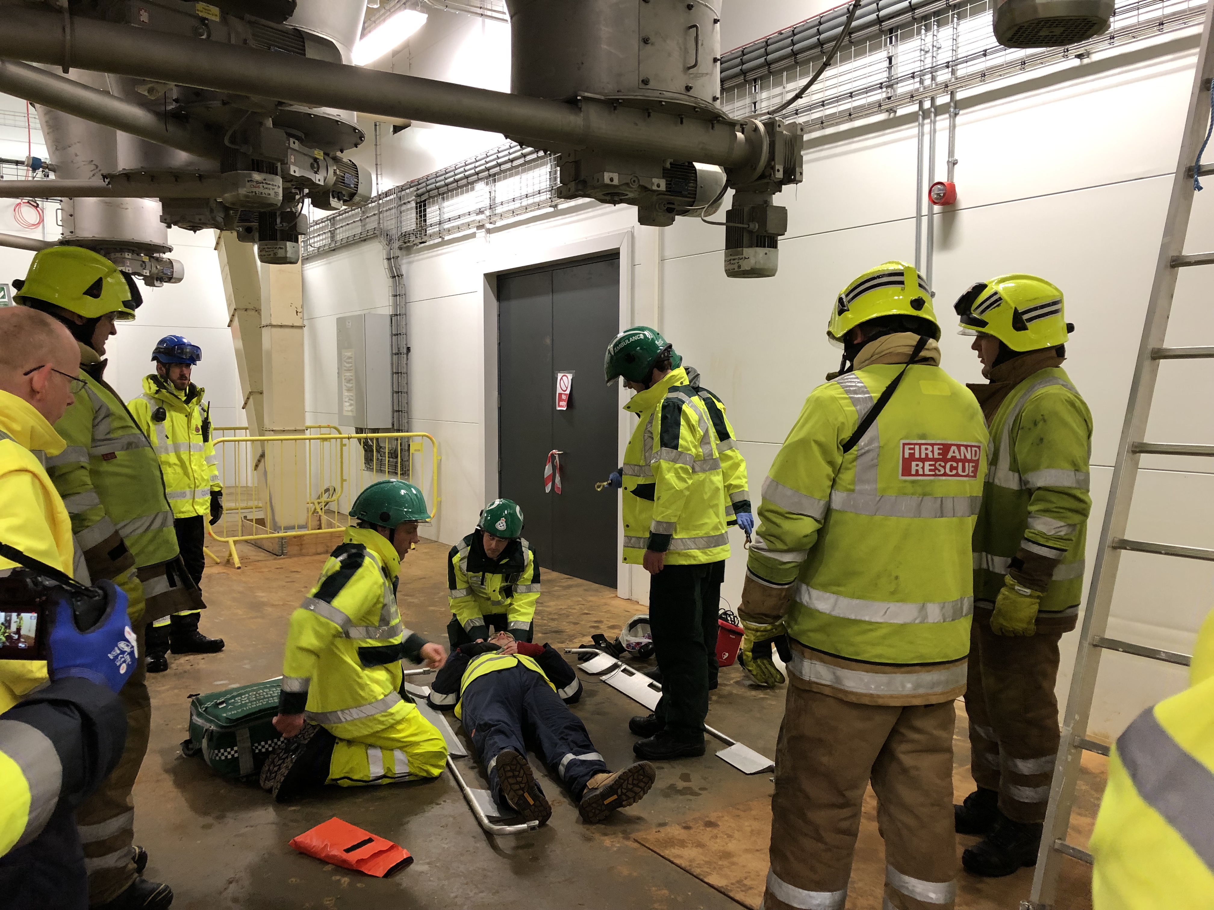 Emergency crews working on a major head injury scenario presented at the training day at the Mowi Fish Feed Plant in Kyleakin