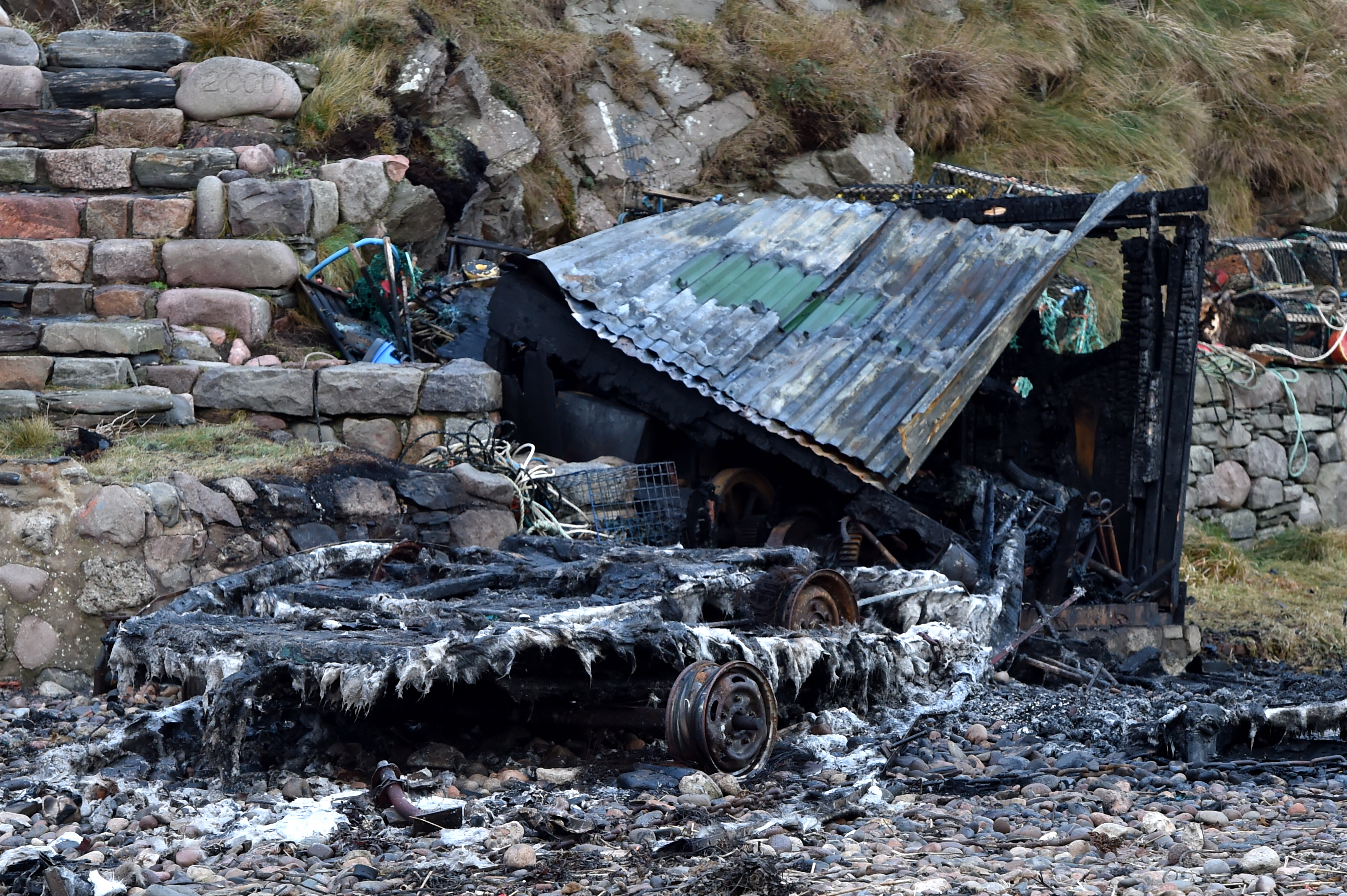 The boats are charred and blackened as a result of the incident.