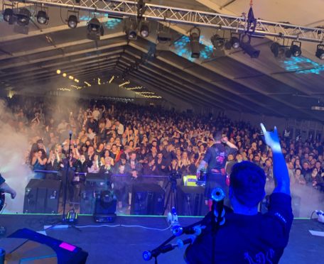 The Red Hot Chili Pipers entertain revellers at the first-ever Hogmanay at the Haughs in Turriff