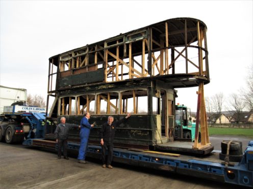 Joe Mackie, Gordon Mills and Ian Souter of the Aberdeen and District Transport Preservation Trust having inspected Aberdeen tram 15 on low-loader following its arrival on site at Alford.