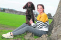 Fitness: Dr Anne Rennie, herself a keen long-distance runner, with her three-year-old cocker spaniel Winston at Bught Park in Inverness.
