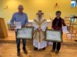Ewen MacDonald,  Father Domenico Zanre of St Columba’s R.C Church in Culloden and Helen MacGilp with their  Benemerenti papal awards, awarded by Pope Francis.