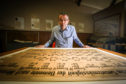 Professor David O’Hagan with the recently conserved periodic table.