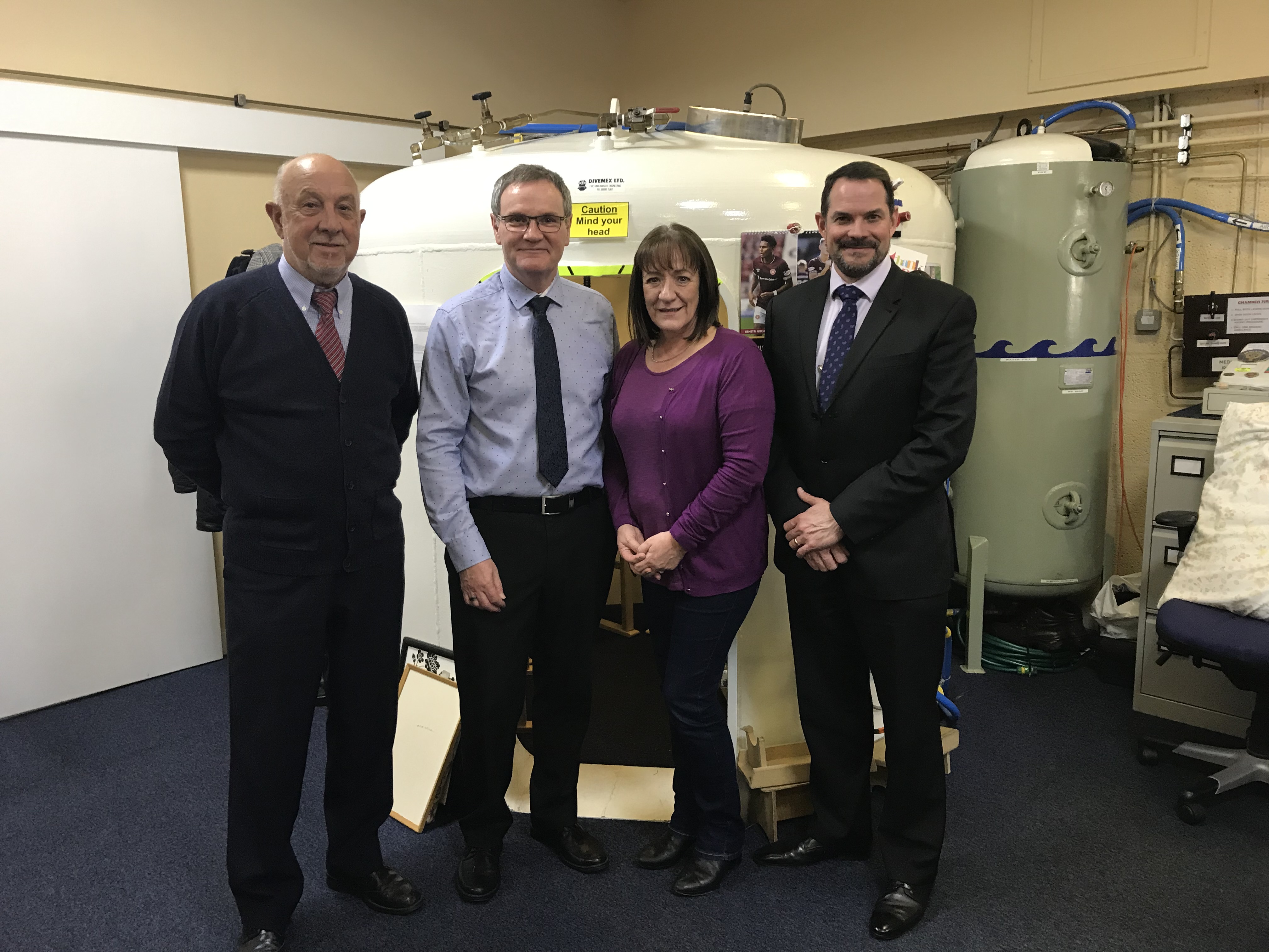 Jim Craig, MS Therapy Centre volunteer, Steve Simpson,  Bristow Helicopters ECR Simulator & Facilities Manager, Eileen Matthew, MS Therapy Centre manager and Matt Rhodes, Bristow Director UK & Turkmenistan Oil and Gas
