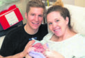 New parents Stephanie Rychlo and RAF Typhoon pilot, Jordan Rychlo and new born son Logan.