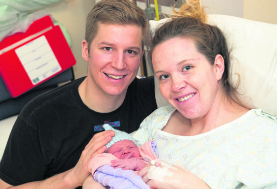 New parents Stephanie Rychlo and RAF Typhoon pilot, Jordan Rychlo and new born son Logan.
