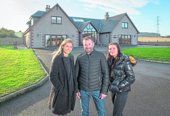 Dad and daughters, Martin, Kelsie and Becky Neish at their home in Keith, Moray.
Picture by Jason Hedges.