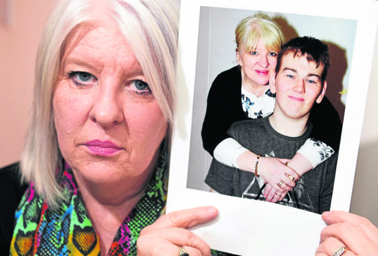 Tracey Gibbon with a picture of her son Kyle who has ADHD has been stuck in Carstairs with no criminal record or sign of release.