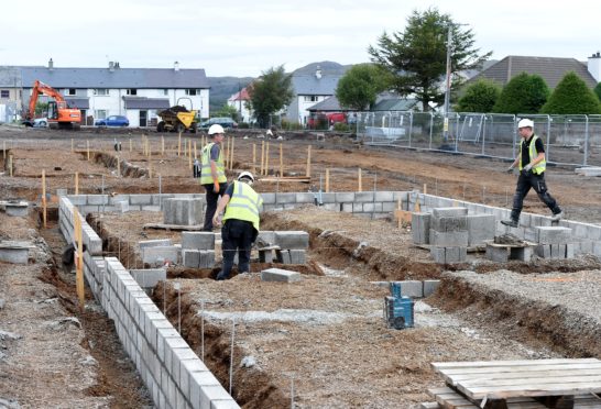 Workers in August on the new development at the Birches area in Kyleakin near to where the overhead cables were portraying sparks last night. Picture by Sandy McCook