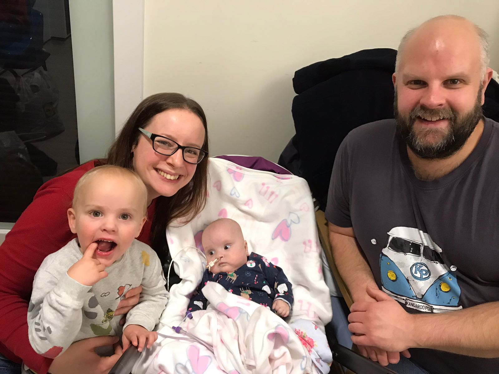 Ruth Stormont with son Ben, baby Carys and partner Gareth Vaughan, who has raised over £4,550 for The Archie Foundation from a fundraising bake sale