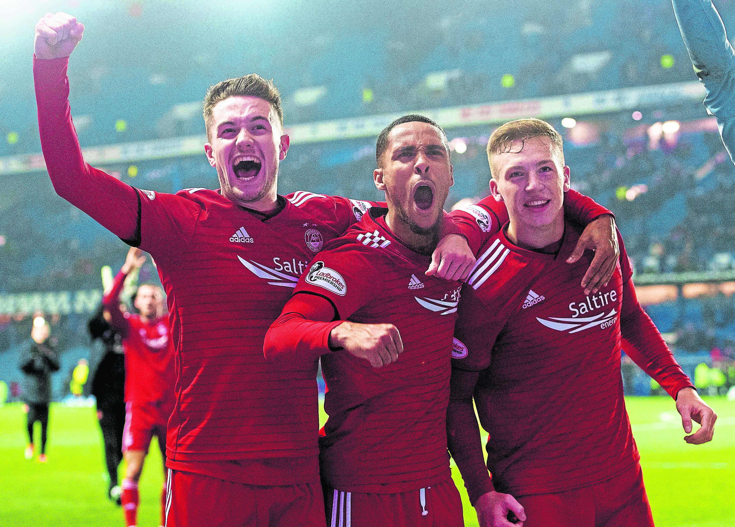 From left, Scott Wright, Max Lowe and Lewis Ferguson celebrate at Ibrox after beating Rangers