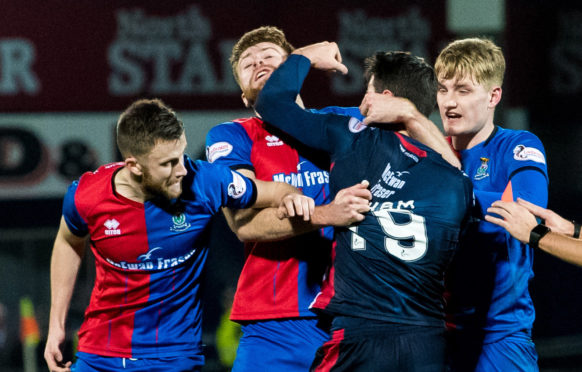 29/12/18 LADBROKES CHAMPIONSHIP
ROSS COUNTY VS INVERNESS CT
THE GLOBAL ENERGY STADIUM-DINGWALL
Ross County's Brian Graham (right) is sent off after throwing a punch at Inverness CT's Shaun Rooney.