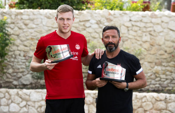 Sam Cosgrove and Derek McInnes received their December awards in Dubai.