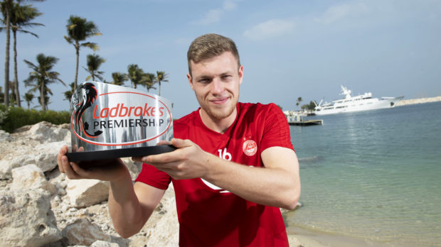 Sam Cosgrove with his trophy for December's player of the month.