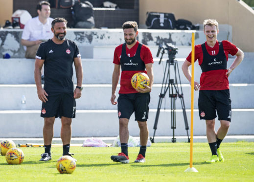 Derek McInnes with Graeme Shinnie and Gary Mackay-Steven in Dubai.