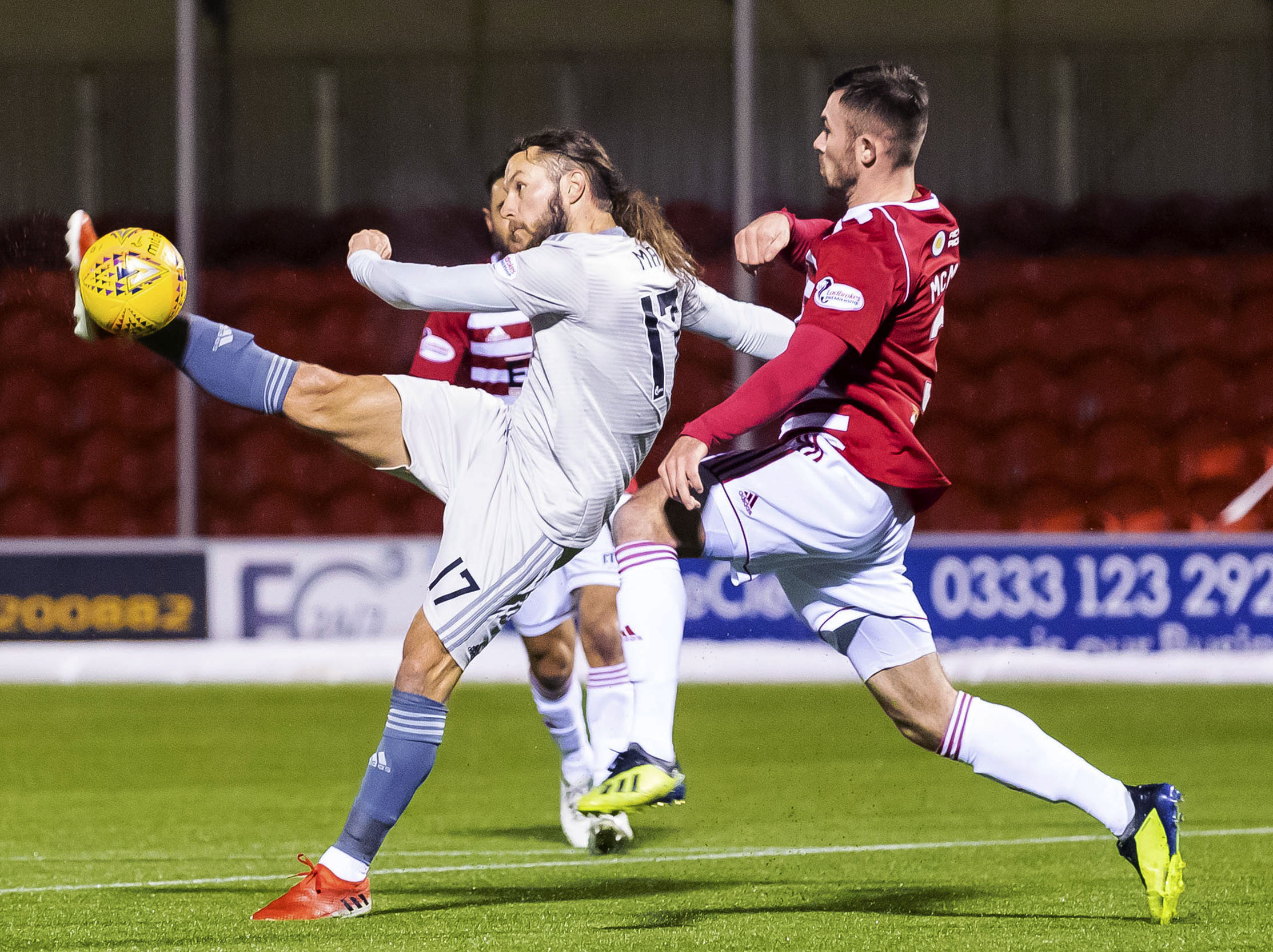 Aberdeen's Stevie May competes with Scott McMann