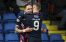 Ross County's Billy Mckay congratulates teammate Declan McManus after his third strike of the season opened the scoring in Dingwall