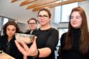 Silversmith Megan Falconer shows a hammered silver bowl to Banff Academy pupils (L-R) Ayesha Argo, Claire Campbell and Alana Cameron.