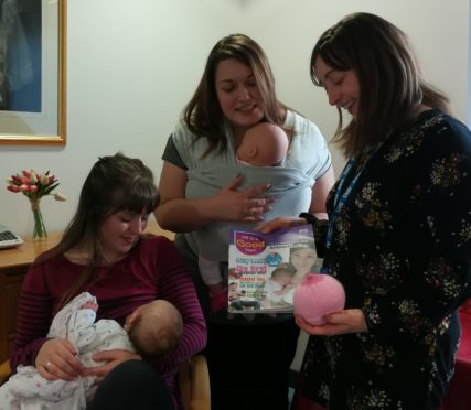 Left is breastfeeding mother Phoebe Johnson with her baby girl India, middle is community nurse Lindsay Michie and left is health visitor Louise Whyte