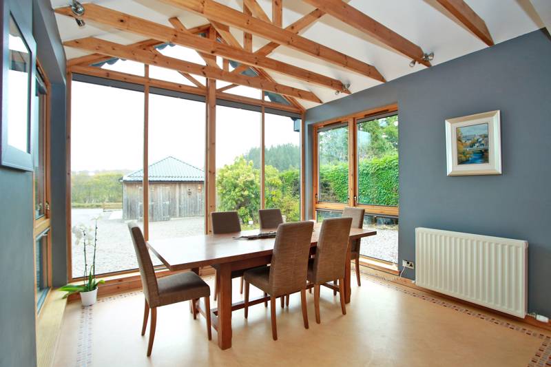 Dining Area: On open-plan with the lounge, this area features large windows