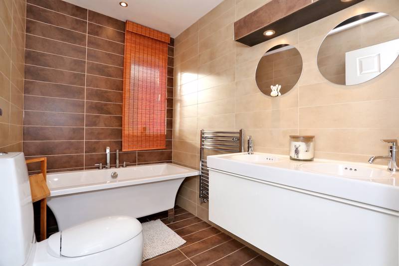 Family Bathroom: Luxurious bathroom fitted with a white suite