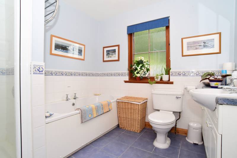 Family Bathroom: Includes four piece suite comprising toilet, wash hand basin, bath and separate shower unit