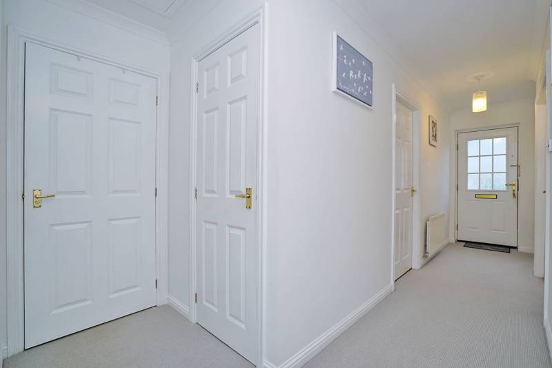 Entrance Hall: Includes built-in storage cupboard
