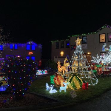 The Malcolm's Way Christmas lights display raised cash for a new playground.