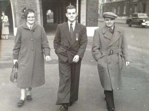 Peter Strachan with his parents John and Elsie Strachan by his side after he received the Stanhope Gold Medal in 1952