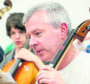 John Mustard, Moray Councils head of music instruction services, quit in protest at a proposed 85% price rise for lessons.