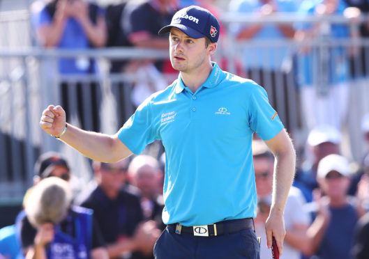 David Law of Scotland celebrates after making this eagle putt on the 18th green to win  he ISPS Handa Vic Open