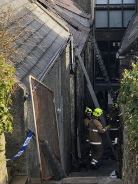 Emergency services were called to the blaze in a two-storey dwelling house in Burns Lane just before midnight on Saturday evening.