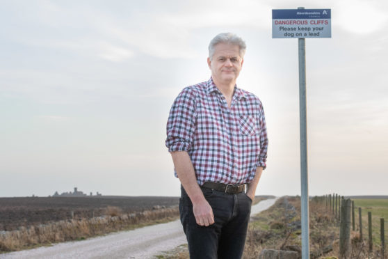 Councillor Alan Fakley was one of the people campaigning for dog safety at Slain Castle and is glad a sign has been put up near the castle grounds to warn pet owners of the hazards.