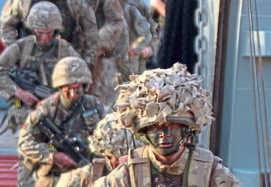 Troop leaving the landing craft.