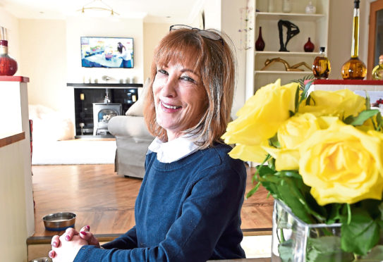 June Macdonald in her home at 36 Redwood Crescent, Inverness.