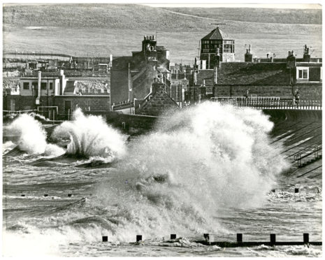 Angry seas pound the ramparts of Footdee.